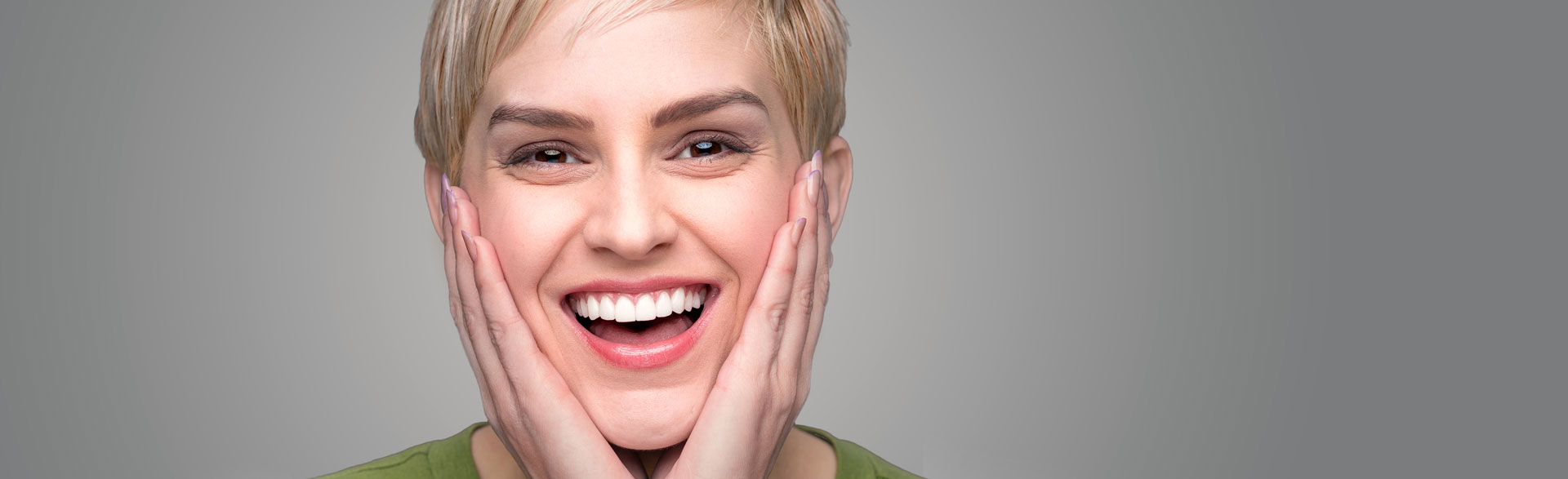 Woman smiling after having tooth bonding treatment