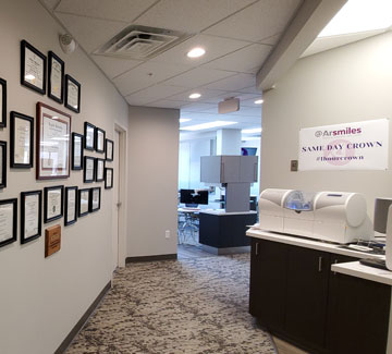A bright and clean hallway leading to treatment rooms at Arsmiles Dental, reflecting professionalism and care.