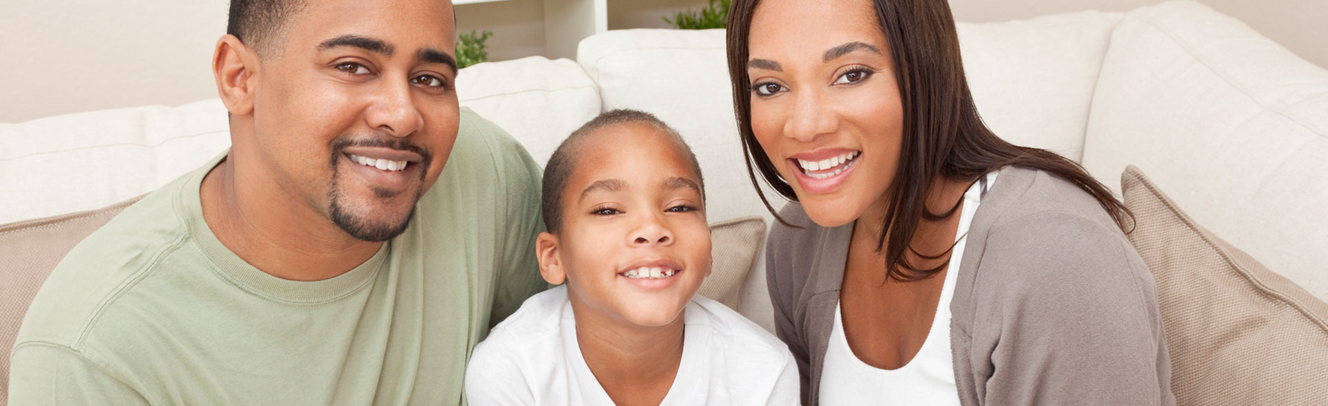 A beautiful family is smiling after having dental implants