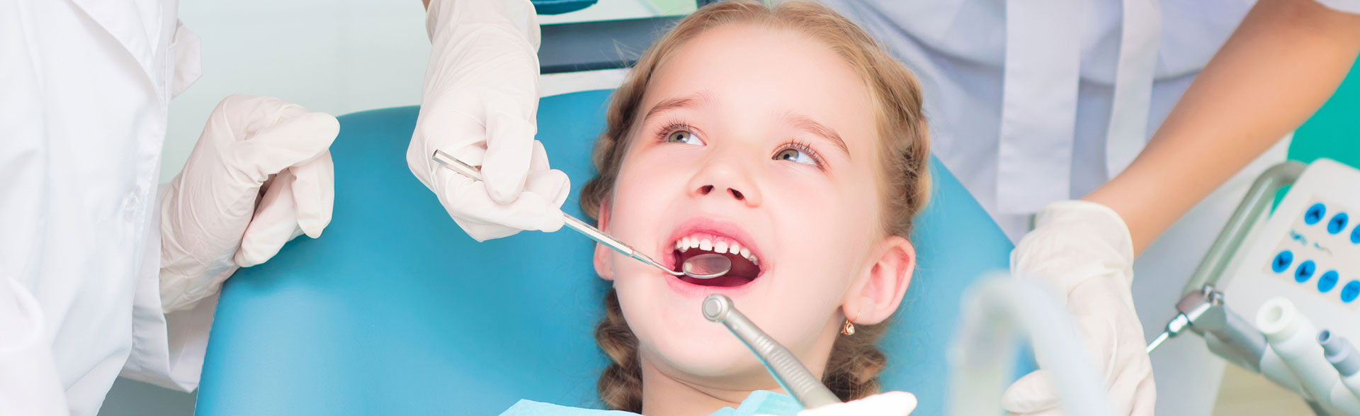 A girl having pre-orthodontic space management to improve alignment and oral development.