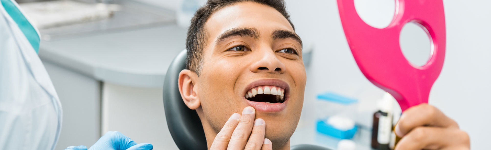 A man is smiling after white composite fillings