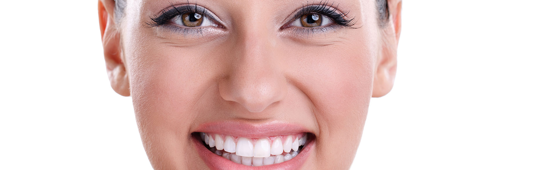 A confident woman showcasing a perfect smile, representing smile makeover transformations.