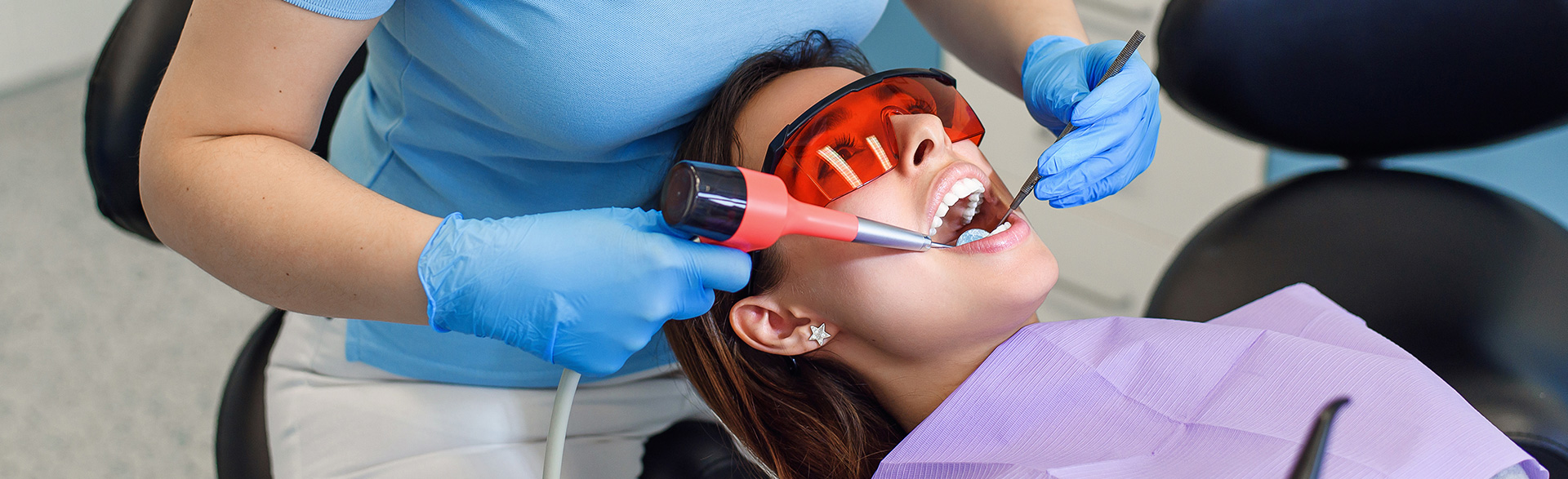 A dental professional providing restorative dentistry services to improve oral health.