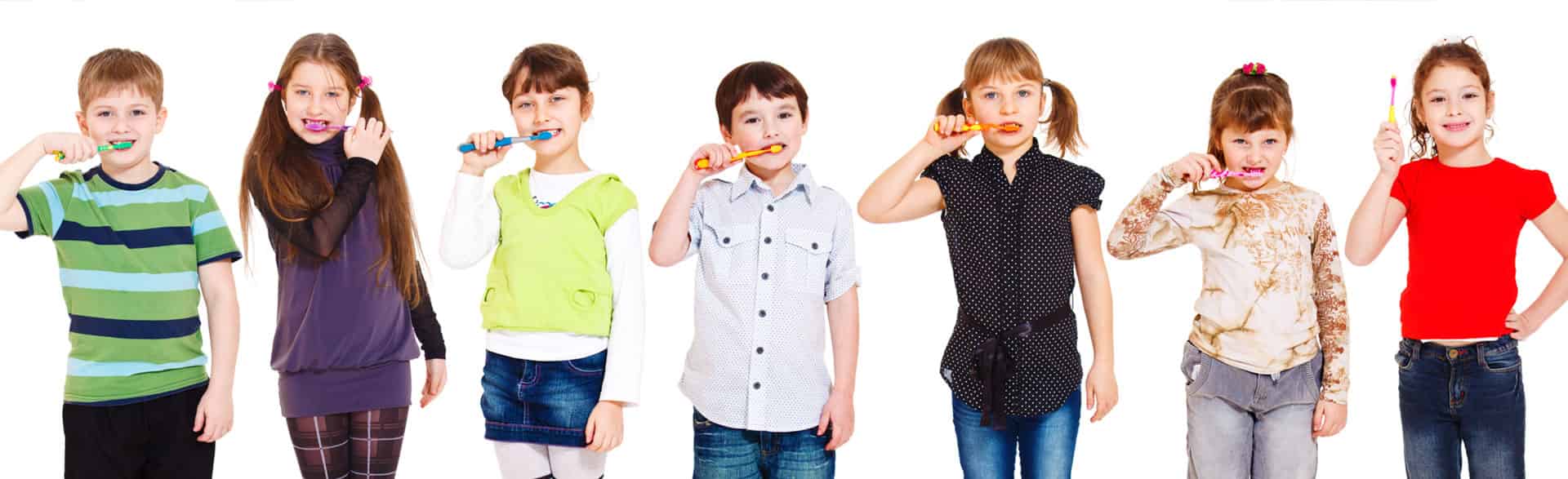 Children brushing their teeth, emphasizing the importance of dental sealants and oral hygiene.