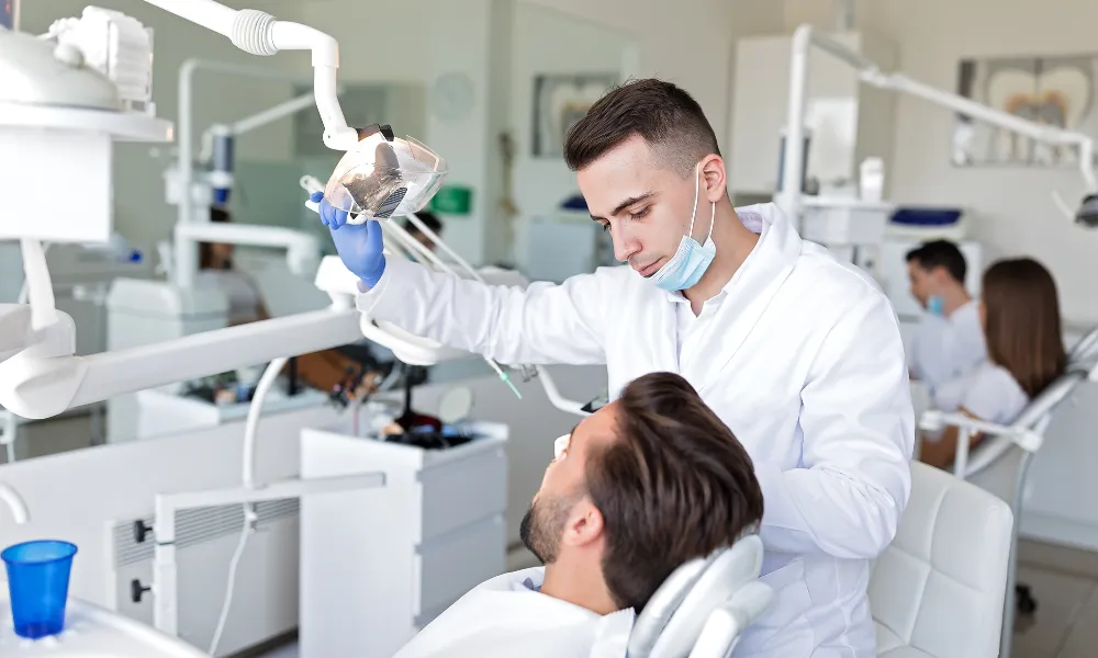 dentist performing dental exam during first appointment in fairlawn oh