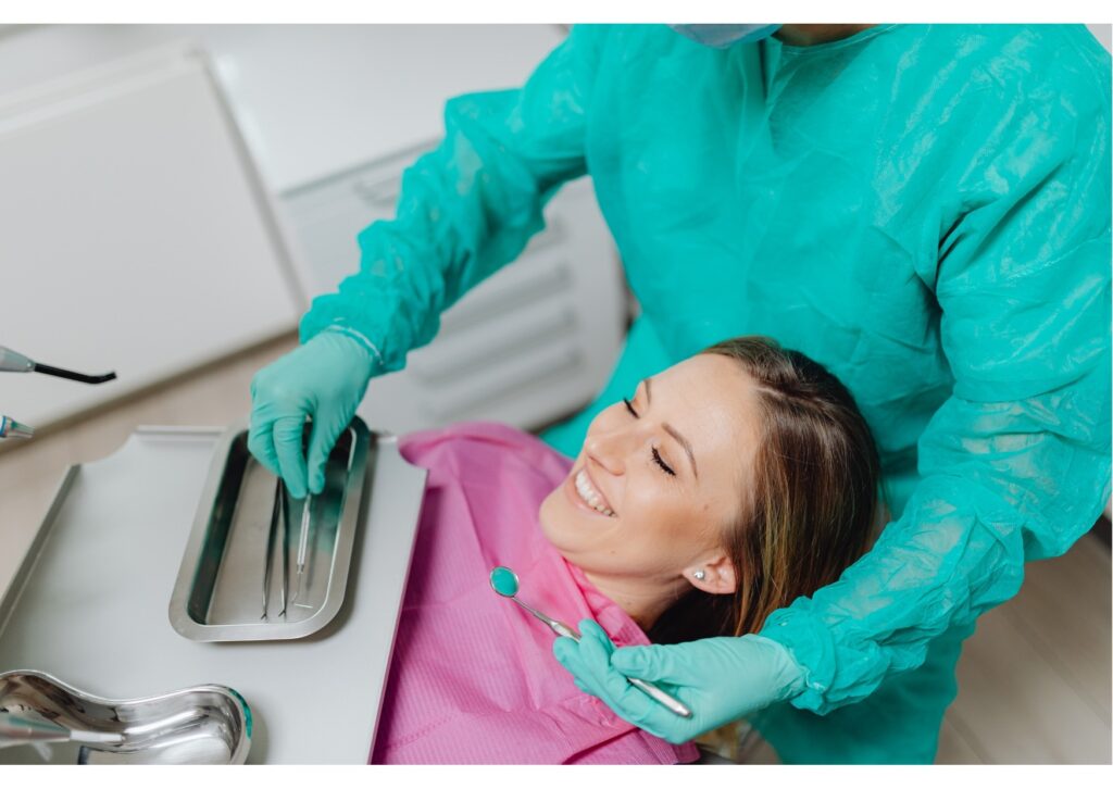 Patient receiving professional teeth whitening treatment from a dentist in a dental clinic.
