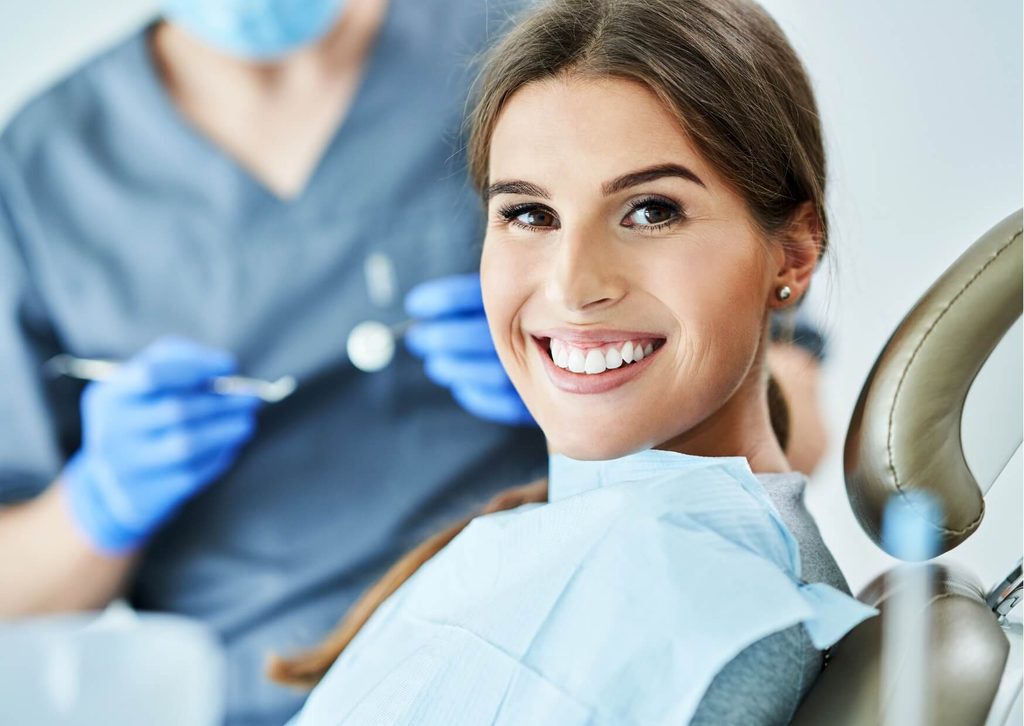Smiling patient after a smile makeover consultation, showing healthy, bright teeth and cosmetic dentistry results.